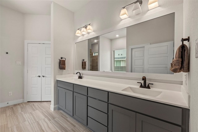 29510 Enchanted Breeze Ln, Katy, TX 77494 - bathroom with double vanity, baseboards, and a shower