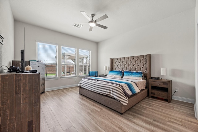 29510 Enchanted Breeze Ln, Katy, TX 77494 - bedroom featuring light wood-style floors, baseboards, and a ceiling fan