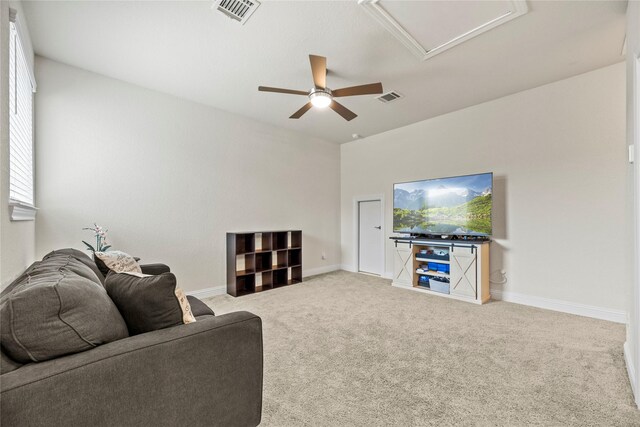 29510 Enchanted Breeze Ln, Katy, TX 77494 - living room featuring a ceiling fan, carpet, baseboards, and attic access