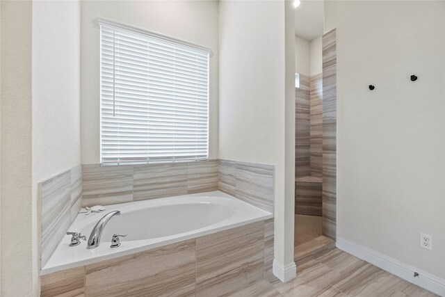 29510 Enchanted Breeze Ln, Katy, TX 77494 - bathroom with a garden tub and baseboards