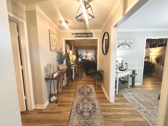 1308 Hagan St, Crockett, TX 75835 - hallway with wood finished floors, baseboards, and crown molding