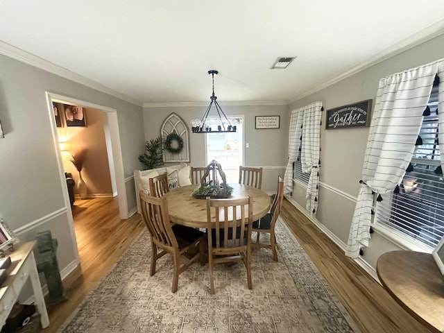 1308 Hagan St, Crockett, TX 75835 - dining room featuring wood finished floors, ornamental molding, and baseboards