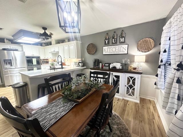 1308 Hagan St, Crockett, TX 75835 - dining room featuring light wood finished floors and a ceiling fan