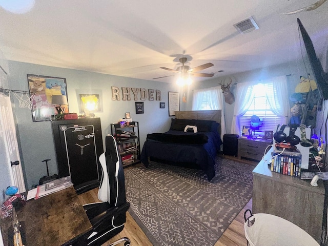 1308 Hagan St, Crockett, TX 75835 - bedroom with wood finished floors and ceiling fan