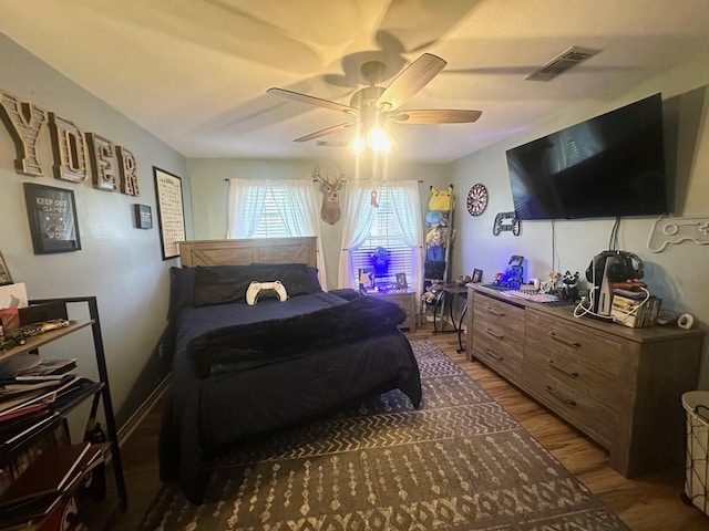 1308 Hagan St, Crockett, TX 75835 - bedroom featuring wood finished floors and a ceiling fan