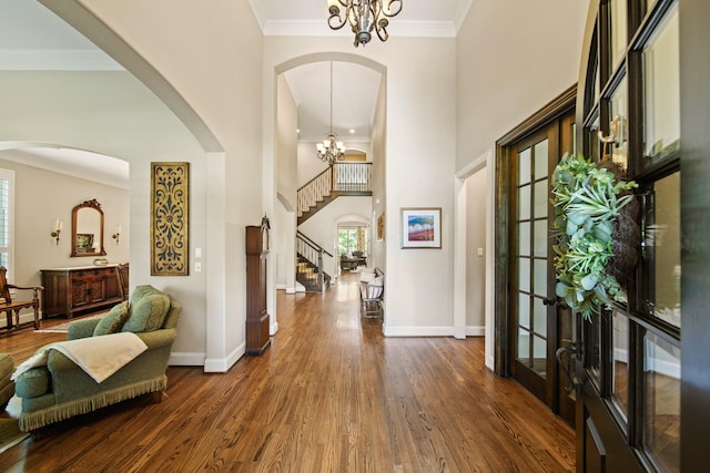 77 Big Trl, Missouri City, TX 77459 - foyer with a chandelier, dark wood-style flooring, baseboards, stairs, and crown molding