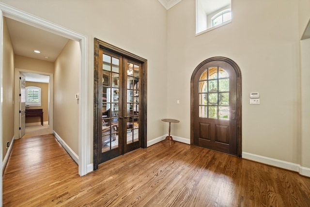 77 Big Trl, Missouri City, TX 77459 - foyer entrance with french doors, healthy amount of natural light, light wood-style floors, and crown molding