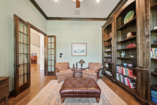 77 Big Trl, Missouri City, TX 77459 - living area featuring french doors, ornamental molding, wood finished floors, ceiling fan, and baseboards