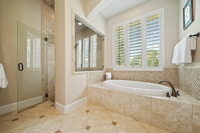 77 Big Trl, Missouri City, TX 77459 - bathroom featuring tile patterned flooring, a bath, a stall shower, and baseboards