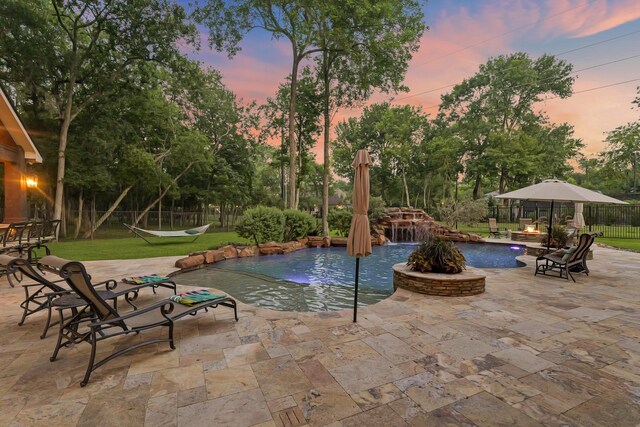 77 Big Trl, Missouri City, TX 77459 - pool at dusk featuring a patio