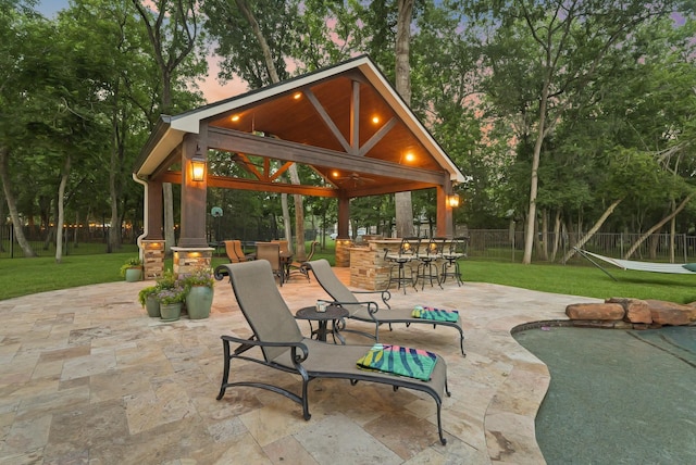 77 Big Trl, Missouri City, TX 77459 - patio terrace at dusk featuring a gazebo and a patio area
