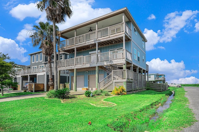 1401 103rd St, Galveston, TX 77554 - view of building exterior featuring driveway and stairway
