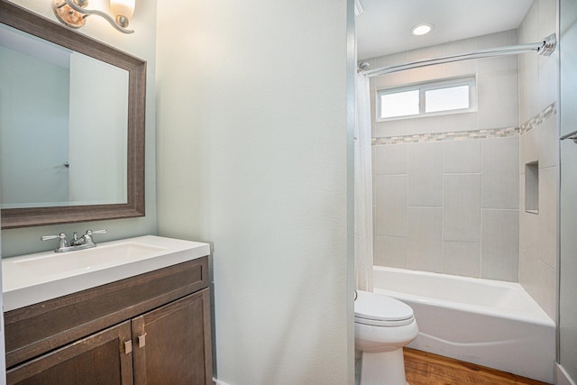 1401 103rd St, Galveston, TX 77554 - full bath featuring toilet, vanity, wood finished floors, shower / tub combination, and recessed lighting