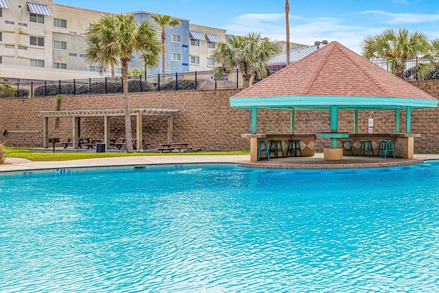 9520 Seawall Blvd Unit 338, Galveston, TX 77554 - community pool featuring a gazebo and a pergola