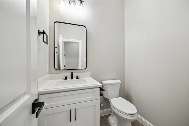 26800 Saddle Horn, Waller, TX 77484 - bathroom featuring toilet, vanity, and baseboards