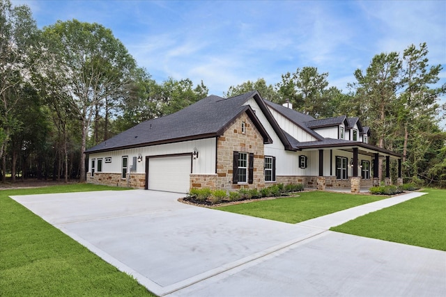 26800 Saddle Horn, Waller, TX 77484 - modern farmhouse with stone siding, board and batten siding, a porch, a garage, and a front yard