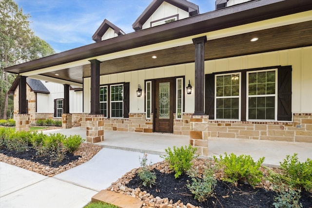 26800 Saddle Horn, Waller, TX 77484 - entrance to property with covered porch, board and batten siding, and stone siding