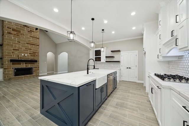 26800 Saddle Horn, Waller, TX 77484 - kitchen with appliances with stainless steel finishes, a sink, tasteful backsplash, white cabinetry, and open shelves