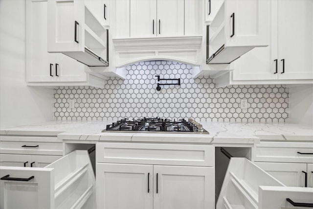 26800 Saddle Horn, Waller, TX 77484 - kitchen with stainless steel gas stovetop, white cabinets, and decorative backsplash