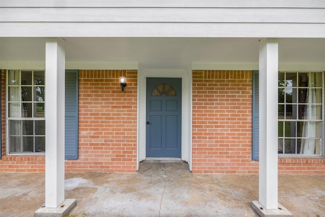 2715 Tinkler St, Rock Island, TX 77470 - view of exterior entry with brick siding and covered porch