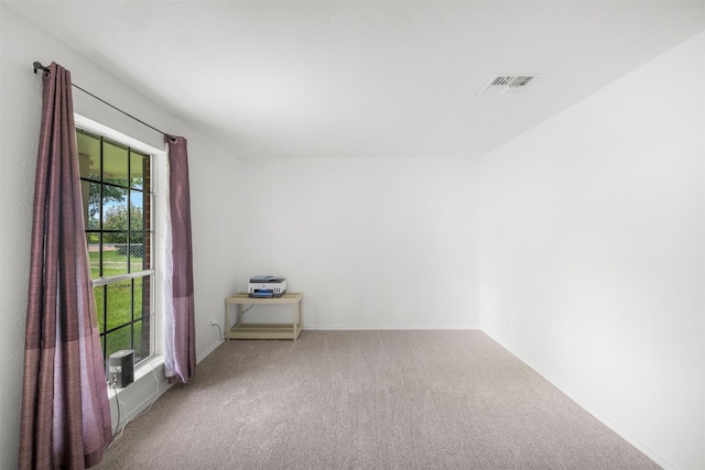 2715 Tinkler St, Rock Island, TX 77470 - spare room featuring carpet and baseboards