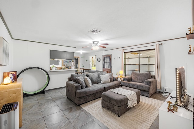 2715 Tinkler St, Rock Island, TX 77470 - living area featuring a ceiling fan and healthy amount of natural light