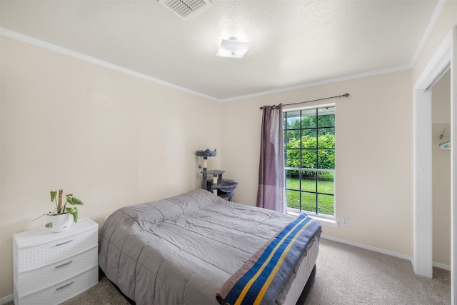 2715 Tinkler St, Rock Island, TX 77470 - carpeted bedroom with baseboards, ornamental molding, and a textured ceiling