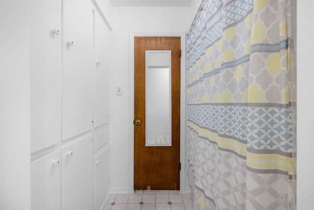 2715 Tinkler St, Rock Island, TX 77470 - hallway with light tile patterned flooring