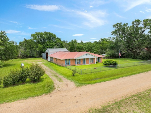 2715 Tinkler St, Rock Island, TX 77470 - view of front facade featuring driveway, metal roof, a garage, and a view of trees