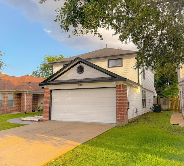 18323 River Sage Dr, Houston, TX 77084 - traditional-style home with brick siding, central AC, driveway, and a garage