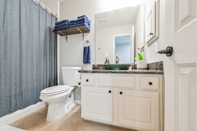 2803 Canyon Dr, Pearland, TX 77584 - bathroom featuring toilet, vanity, a shower with shower curtain, and tile patterned flooring