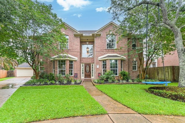 2803 Canyon Dr, Pearland, TX 77584 - traditional home featuring brick siding and a detached garage