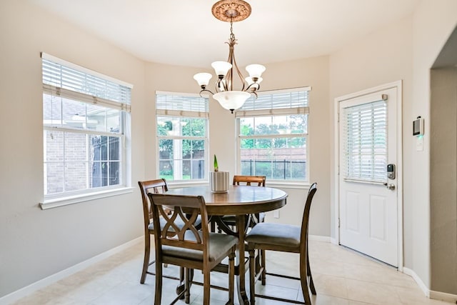 2803 Canyon Dr, Pearland, TX 77584 - dining area featuring a chandelier, healthy amount of natural light, and baseboards