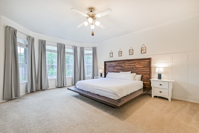 2803 Canyon Dr, Pearland, TX 77584 - bedroom with light colored carpet, ornamental molding, and a ceiling fan