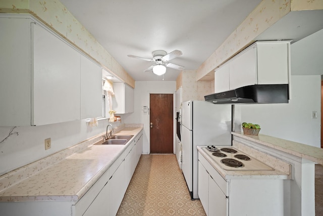 6027 Dellfern Dr, Houston, TX 77035 - kitchen featuring under cabinet range hood, a sink, ceiling fan, light countertops, and white cabinetry