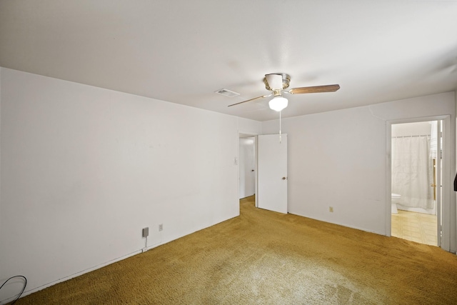 6027 Dellfern Dr, Houston, TX 77035 - unfurnished bedroom with carpet floors, connected bathroom, and ceiling fan