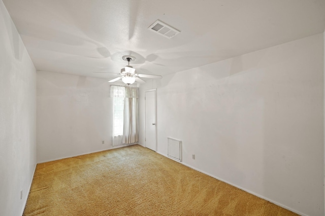 6027 Dellfern Dr, Houston, TX 77035 - empty room with light colored carpet, a ceiling fan, and baseboards