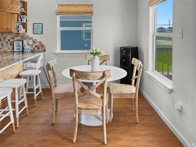 753 Bluewater Hwy, Surfside Beach, TX 77541 - dining space featuring light wood-style floors, plenty of natural light, and baseboards