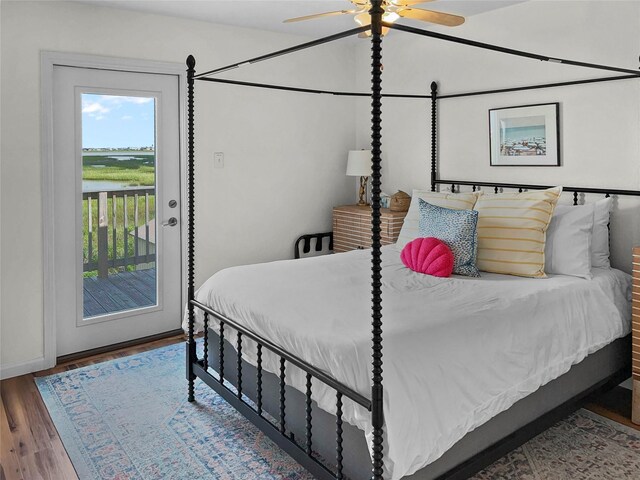 753 Bluewater Hwy, Surfside Beach, TX 77541 - bedroom with access to outside, wood finished floors, baseboards, and ceiling fan