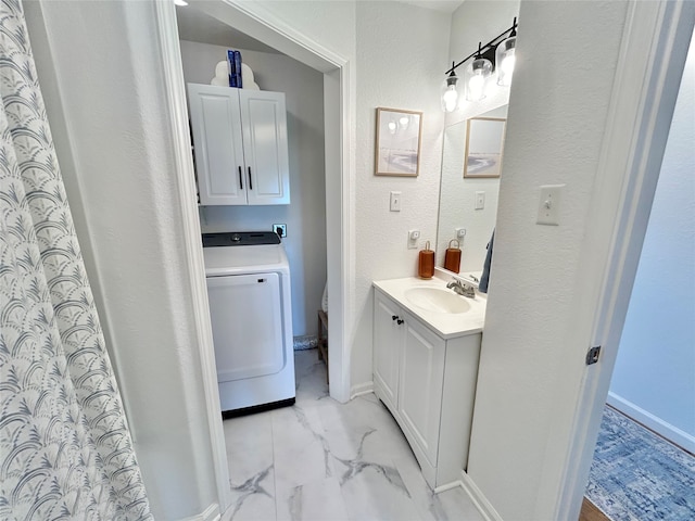 753 Bluewater Hwy, Surfside Beach, TX 77541 - bathroom featuring washer / clothes dryer, marble look tile flooring, vanity, baseboards, and toilet