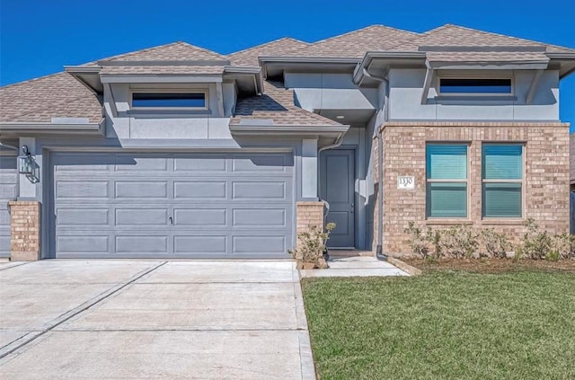 1330 Munson Valley Rd, Richmond, TX 77406 - prairie-style house with concrete driveway, a garage, stucco siding, and a shingled roof