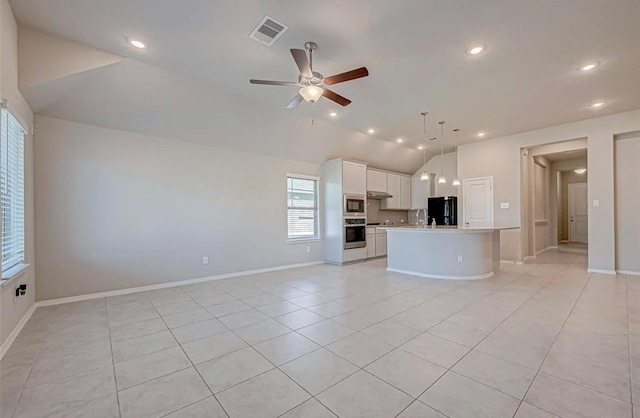1330 Munson Valley Rd, Richmond, TX 77406 - unfurnished living room featuring lofted ceiling, light tile patterned floors, a ceiling fan, recessed lighting, and baseboards