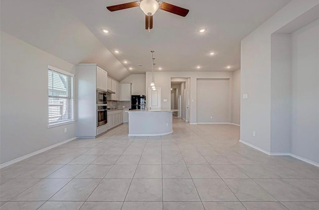 1330 Munson Valley Rd, Richmond, TX 77406 - kitchen featuring appliances with stainless steel finishes, open floor plan, ceiling fan, light countertops, and lofted ceiling
