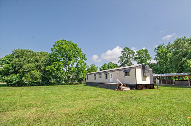 277 Lucy, Livingston, TX 77351 - view of grassy yard with entry steps
