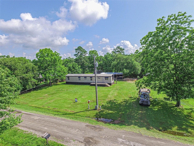 277 Lucy, Livingston, TX 77351 - view of front of home with a front lawn