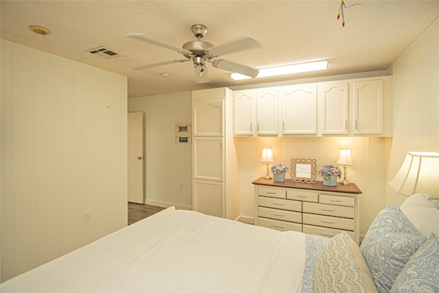 277 Lucy, Livingston, TX 77351 - bedroom featuring a ceiling fan and a textured ceiling