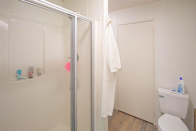 277 Lucy, Livingston, TX 77351 - bathroom with a stall shower, wood finished floors, and toilet