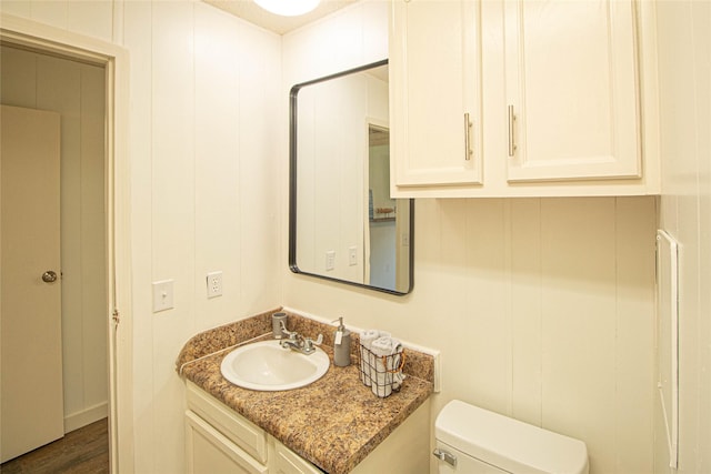 277 Lucy, Livingston, TX 77351 - half bath featuring vanity, toilet, and wood finished floors