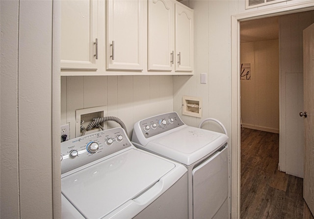 277 Lucy, Livingston, TX 77351 - laundry area featuring cabinet space, separate washer and dryer, and wood finished floors