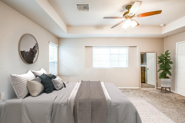11019 Chestnut Path Way, Tomball, TX 77375 - bedroom with a tray ceiling, carpet flooring, baseboards, and a ceiling fan